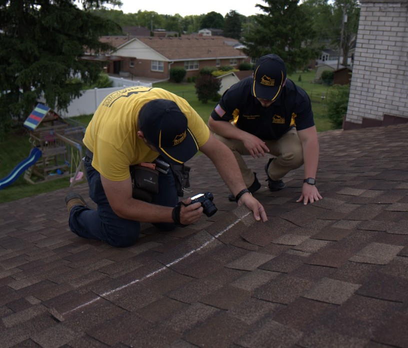 AlphaOne Exteriors team performing a professional roof inspection on an asphalt shingle roof in Dayton, Ohio