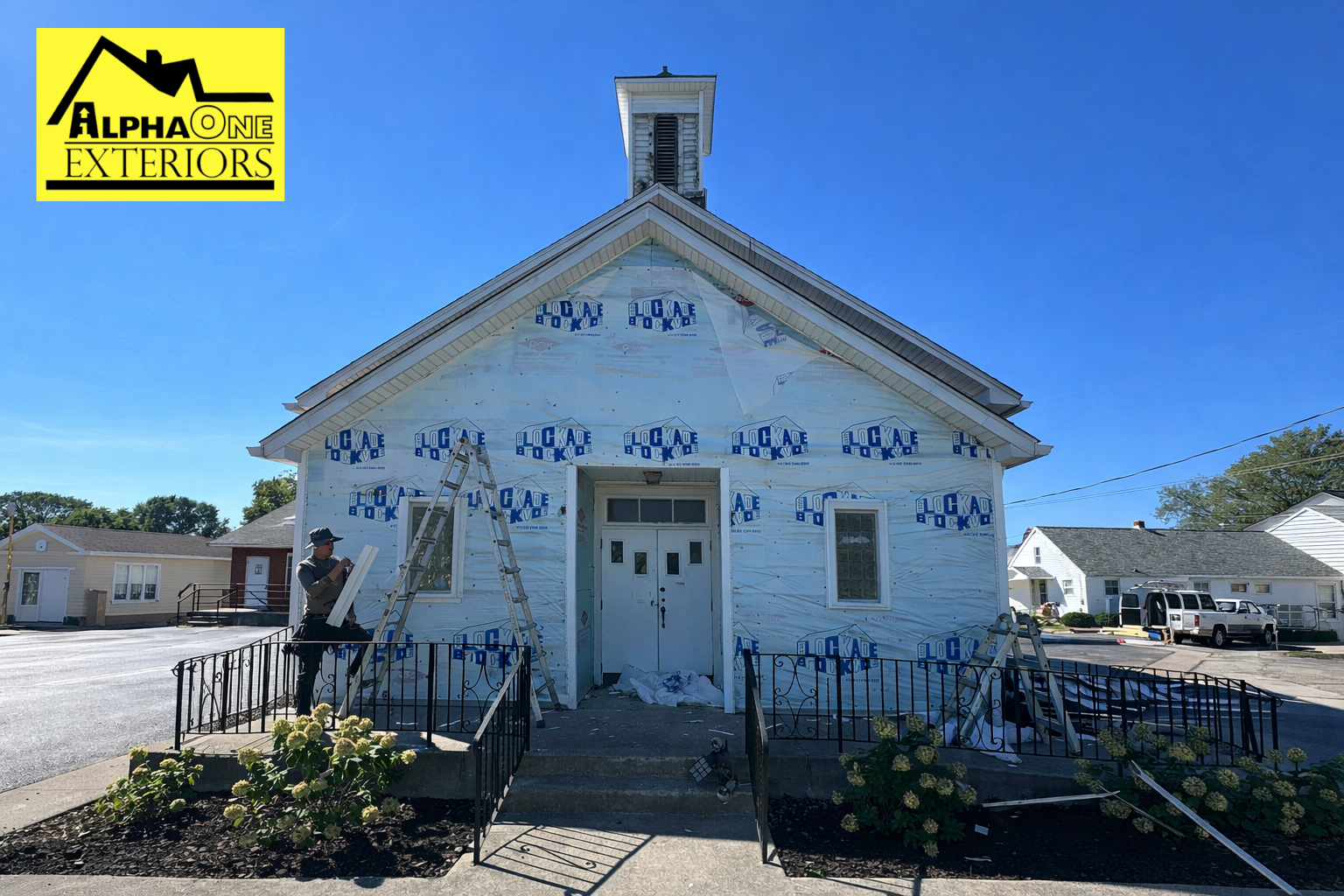 Siding contractor installing house wrap and preparing exterior walls for new siding installation on a home in Dayton, Ohio.