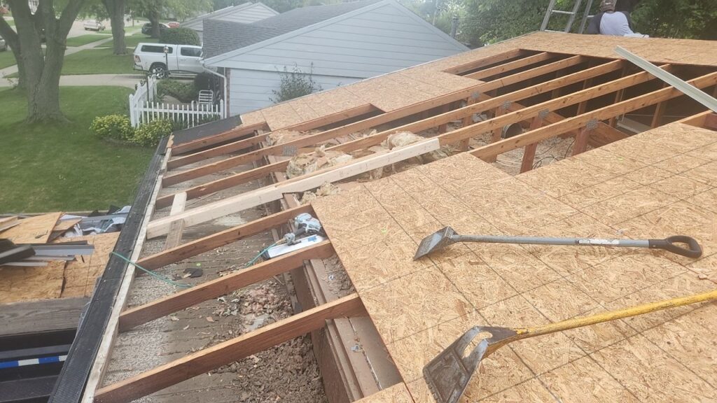 Roof decking repair after shingle tear off showing damaged roof sheathing being replaced during roof replacement in Vandalia Ohio