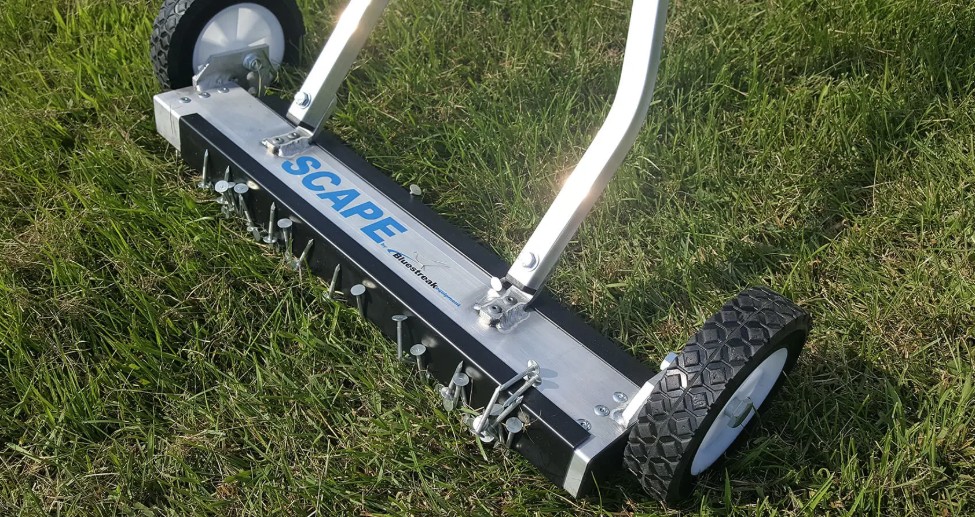 Magnetic nail sweeper tool used by roofing contractors to clean up nails and debris after roof replacement in Dayton Ohio