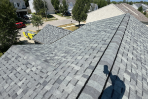 Hail-resistant architectural shingles installed on a residential roof in Huber Heights, Ohio, featuring dimensional gray Atlas Pinnacle Impact shingles.