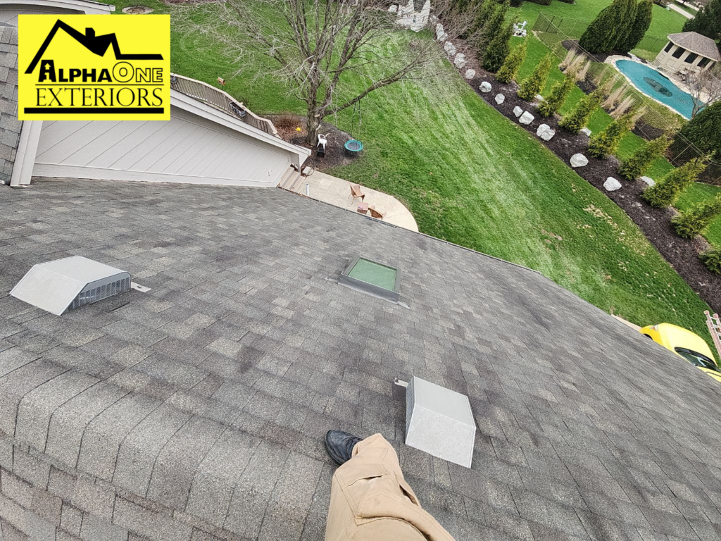 Steep asphalt shingle roof on a home in Centerville Ohio viewed from rooftop during inspection