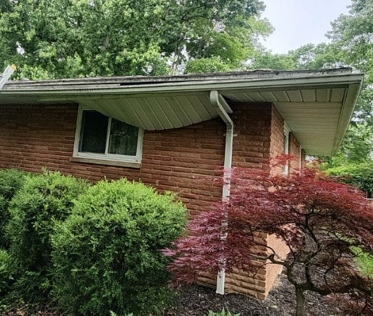 Loose soffit panels under the eave of a home in Beavercreek, Ohio