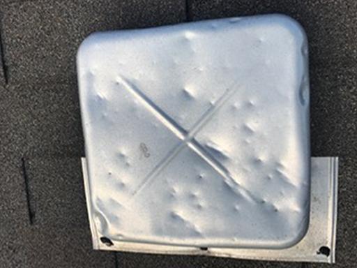 Hail damage dents on a roof vent during a professional hail damage roof inspection in Kettering, Ohio