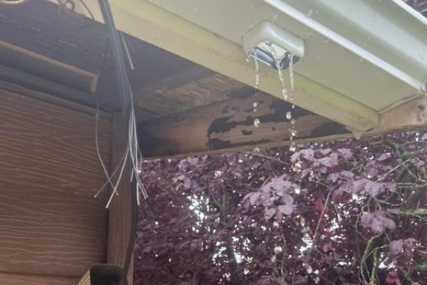 Detached downspout caused by storm damage on a residential home in Tipp City, Ohio