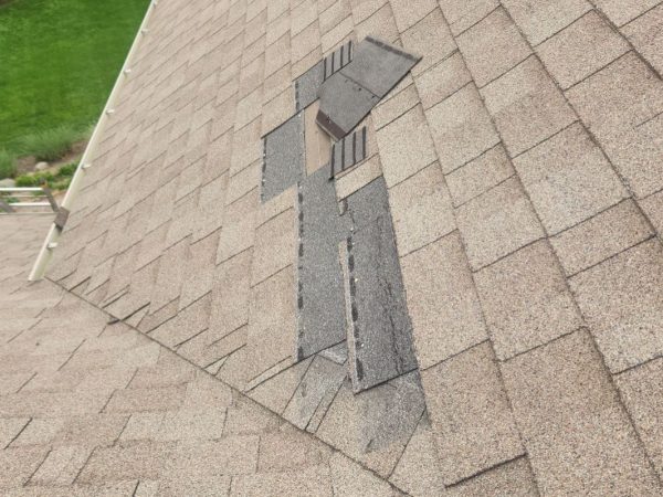 Missing shingles in Dayton Ohio exposing roof underlayment and increasing risk of leaks after wind damage